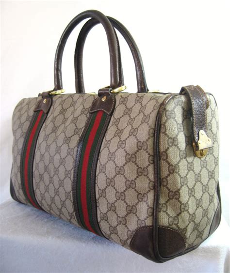 gucci duffel bag serial 474131 525040|Gucci duffle bag vintage.